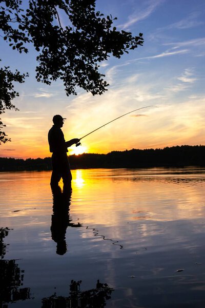 fisherman silhouette during sunset