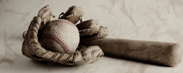 old baseball glove bat and ball on vintage texture background