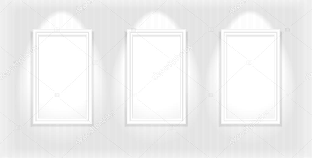 three frames on the light-colored wall