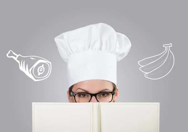 Woman in chef's hat with drawn meat and bananas — Stock Photo, Image