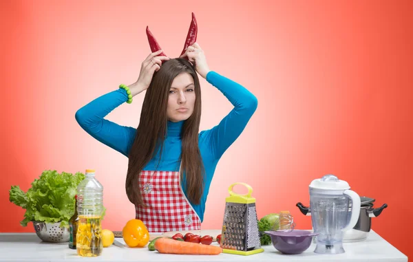 Funny portrait of an angry woman in the kitchen — Stock Photo, Image