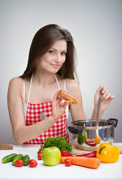 Woman seasoning soup — Stock Photo, Image