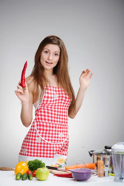 Cooking woman with the red pepper — Stock Photo, Image