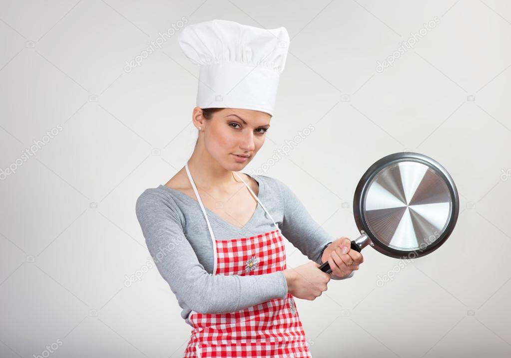 Funny portrait of a woman with the pan