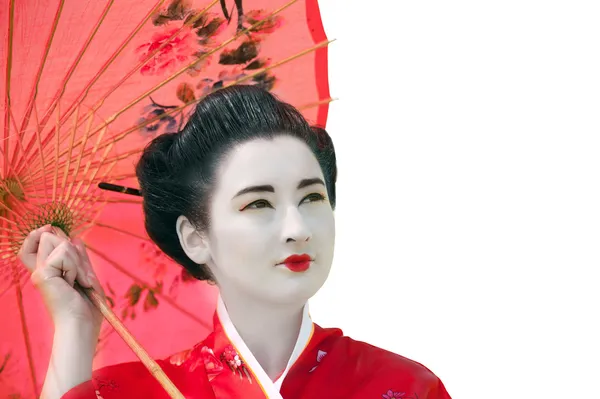 Geisha con paraguas mirando hacia arriba sobre fondo blanco — Foto de Stock