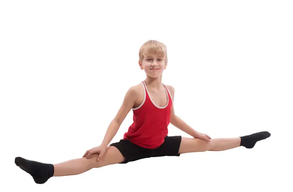 Smiling boy doing horizontal splits — Stock Photo, Image