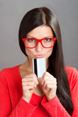 Portrait of a woman with a plastic card