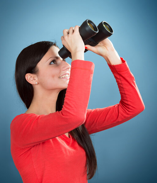 Girl looking through the binoculars