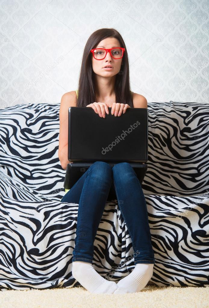 Confused girl with laptop