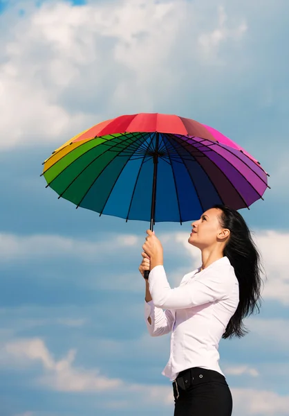Businesswoman with colorful umbrella — Stock Photo, Image
