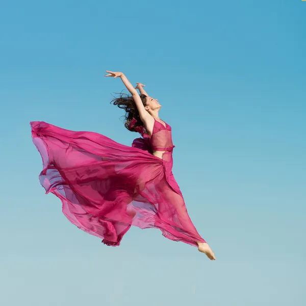 Girl jumping in the air — Stock Photo, Image