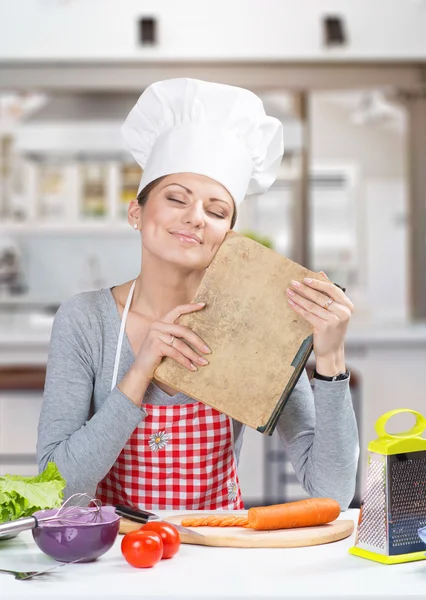 Woman with the old grandmother's cookbook — Stock Photo, Image