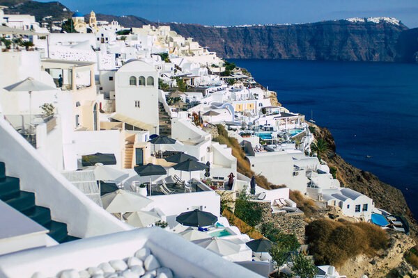 Santorini, Oia, Greece - October 24, 2021 Cityscape of the town of Oia, the small traditional white houses typical of this island are perched on the side of the ancient active volcano