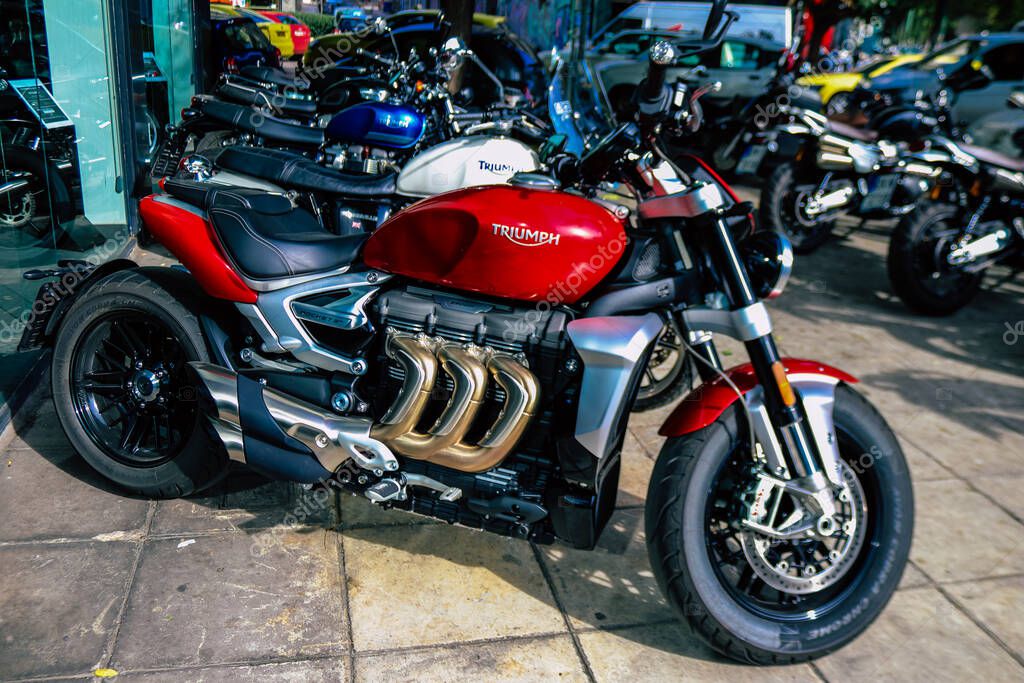 Athens, Greece - November 10, 2021 Triumph motorcycles parked in front of the dealer, the largest UK-owned motorcycle manufacturer offers the Bonneville, Scrambler, Speed and Street Twins models