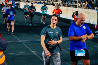 38. Otantik Atina 'daki 10 kilometrelik yol yarışlarının koşucuları, Coronavirus salgınının Yunanistan' ı vurması sonrasında geçen yıl yarışma iptal edildi.