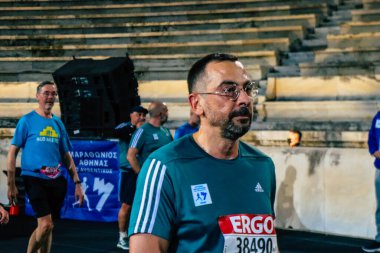 38. Otantik Atina 'daki 10 kilometrelik yol yarışlarının koşucuları, Coronavirus salgınının Yunanistan' ı vurması sonrasında geçen yıl yarışma iptal edildi.