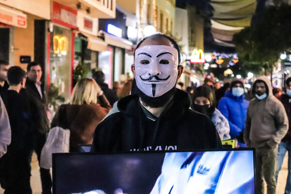 Nicosia, Cyprus - December 25, 2021 Anonymous demonstrate against multinationals for the individual freedoms of animals in the streets of Nicosia during the coronavirus epidemic hitting Cyprus