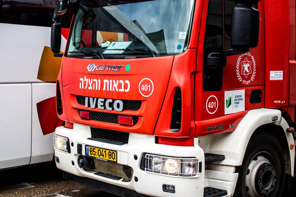 Tel Aviv, Israel - March 15, 2022 Fire truck parked in the streets of Tel Aviv, firefighters responded to put out a minor fire at the entrance to a residential building in the city center