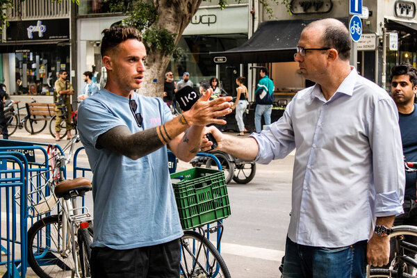 Tel Aviv, Israel - April 08, 2022 Following the Palestinian terrorist attack at the Ilka Bar on Dizengoff Street, journalists reporting the events of last night