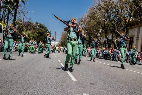 stock image Seville, Spain - May 01, 2022 Parade of professional soldiers from the Spanish Legion, this military unit of the Spanish Army parade through the streets of Seville for the launch of the Feria