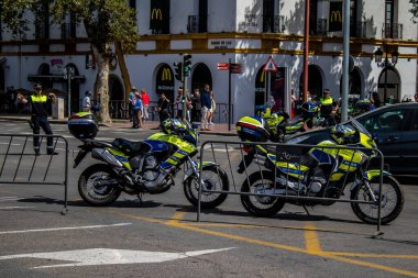 Seville, Spain - May 01, 2022 Police officer in the streets during Feria de Sevilla, the most famous festival in Spain, This celebration is back after two years of absence due to covid pandemic