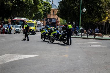 Seville, Spain - May 01, 2022 Police officer in the streets during Feria de Sevilla, the most famous festival in Spain, This celebration is back after two years of absence due to covid pandemic