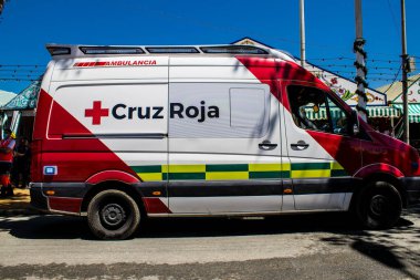 Seville, Spain - May 05, 2022 Ambulance rolling at Feria de Sevilla, Spain's most famous festival, This celebration is back after two years of absence due to covid epidemic