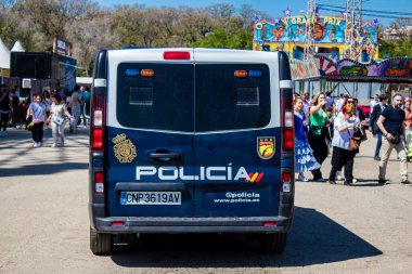 Seville, Spain - May 05, 2022 Police patrolling in the streets during Feria de Sevilla, the most famous festival in Spain, This celebration is back after two years of absence due to covid pandemic
