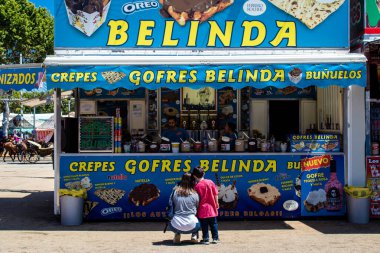Seville, Spain - May 05, 2022 Feria de Sevilla funfair, the attractions and rides are open again, This party is back after two years of absence due to an epidemic of covid