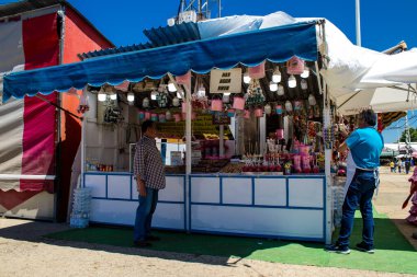 Seville, Spain - May 05, 2022 Feria de Sevilla funfair, the attractions and rides are open again, This party is back after two years of absence due to an epidemic of covid