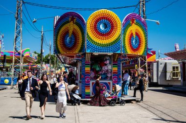 Seville, Spain - May 05, 2022 Feria de Sevilla funfair, the attractions and rides are open again, This party is back after two years of absence due to an epidemic of covid
