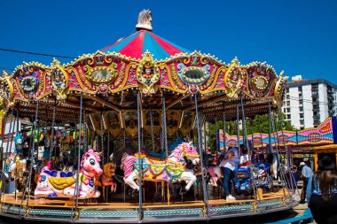 Seville, Spain - May 05, 2022 Feria de Sevilla funfair, the attractions and rides are open again, This party is back after two years of absence due to an epidemic of covid