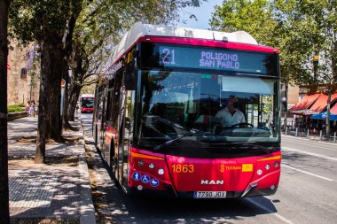Seville, Spain - May 09, 2022 Bus driving through the streets of Seville during the coronavirus outbreak hitting Spain, wearing a mask is mandatory