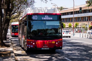 Seville, Spain - May 09, 2022 Bus driving through the streets of Seville during the coronavirus outbreak hitting Spain, wearing a mask is mandatory