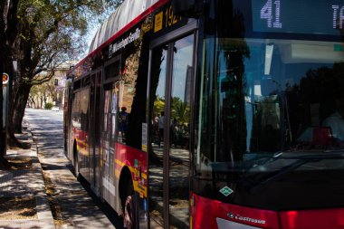 Seville, Spain - May 09, 2022 Bus driving through the streets of Seville during the coronavirus outbreak hitting Spain, wearing a mask is mandatory