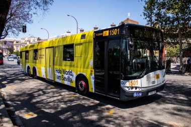 Seville, Spain - May 09, 2022 Bus driving through the streets of Seville during the coronavirus outbreak hitting Spain, wearing a mask is mandatory