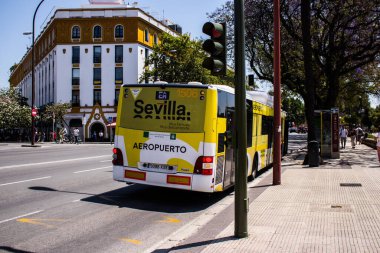 Seville, Spain - May 09, 2022 Bus driving through the streets of Seville during the coronavirus outbreak hitting Spain, wearing a mask is mandatory