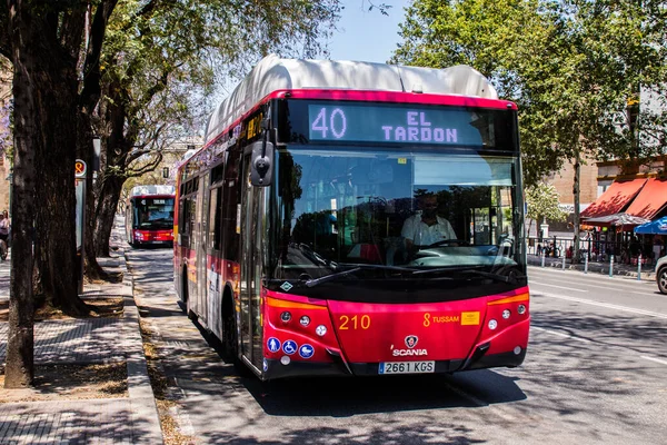 Seville, Spain - May 09, 2022 Bus driving through the streets of Seville during the coronavirus outbreak hitting Spain, wearing a mask is mandatory
