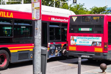 Seville, Spain - May 09, 2022 Bus driving through the streets of Seville during the coronavirus outbreak hitting Spain, wearing a mask is mandatory