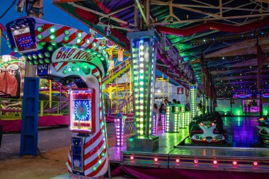 Carmona, Spain - May 11, 2022 Feria de Carmona funfair, attractions and rides are open again, party is back after two years of absence due to an epidemic of covid
