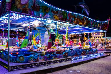 Carmona, Spain - May 11, 2022 Feria de Carmona funfair, attractions and rides are open again, party is back after two years of absence due to an epidemic of covid