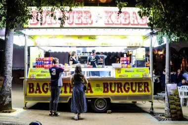Carmona, Spain - May 11, 2022 Feria de Carmona funfair, attractions and rides are open again, party is back after two years of absence due to an epidemic of covid