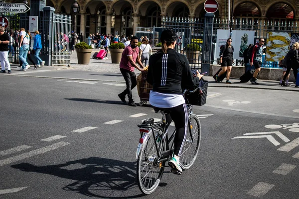 stock image Paris, France - May 21, 2022 People rolling with a bicycle in the streets of Paris during the coronavirus outbreak hitting France