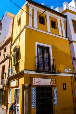 Seville, Spain - July 04, 2022 Facade of a building in the streets of Seville, an emblematic city and the capital of the region of Andalusia, in the south of Spain