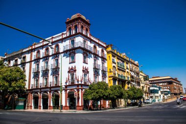 Seville, Spain - July 04, 2022 Facade of a building in the streets of Seville, an emblematic city and the capital of the region of Andalusia, in the south of Spain