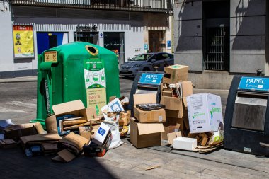 Seville, Spain - July 04, 2022 Garbage container in the streets of Seville, an emblematic city and the capital of the region of Andalusia, in the south of Spain