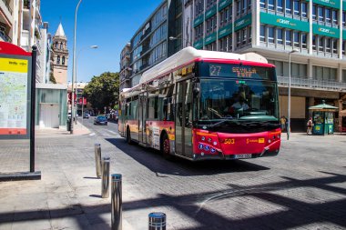 Seville, Spain - July 04, 2022 Bus driving through the streets of Seville during the coronavirus outbreak hitting Spain, wearing a mask is mandatory