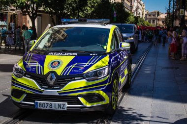 Seville, Spain - July 04, 2022 Police car patrolling in the streets of Seville, an emblematic city and the capital of the region of Andalusia, in the south of Spain