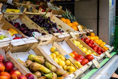 Seville, Spain - July 04, 2022 Vegetables and fruits sold at the Triana market in Seville during the coronavirus outbreak hitting Spain, wearing a mask is mandatory
