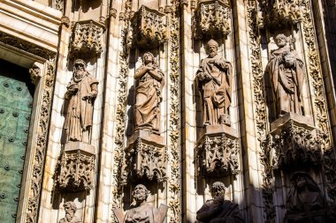 Seville, Spain - June 12, 2022 Facade of the Saint Metropolitan and Patriarchal Cathedral of Seville, It is the largest Gothic cathedral in the world